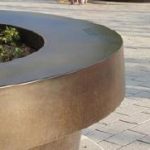 Bronze effect steel to all metalwork such as armrests, bicycle stands, lighting columns and litter bins