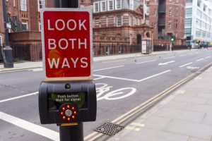 Look both ways sign on a traffic light on Gower STreet