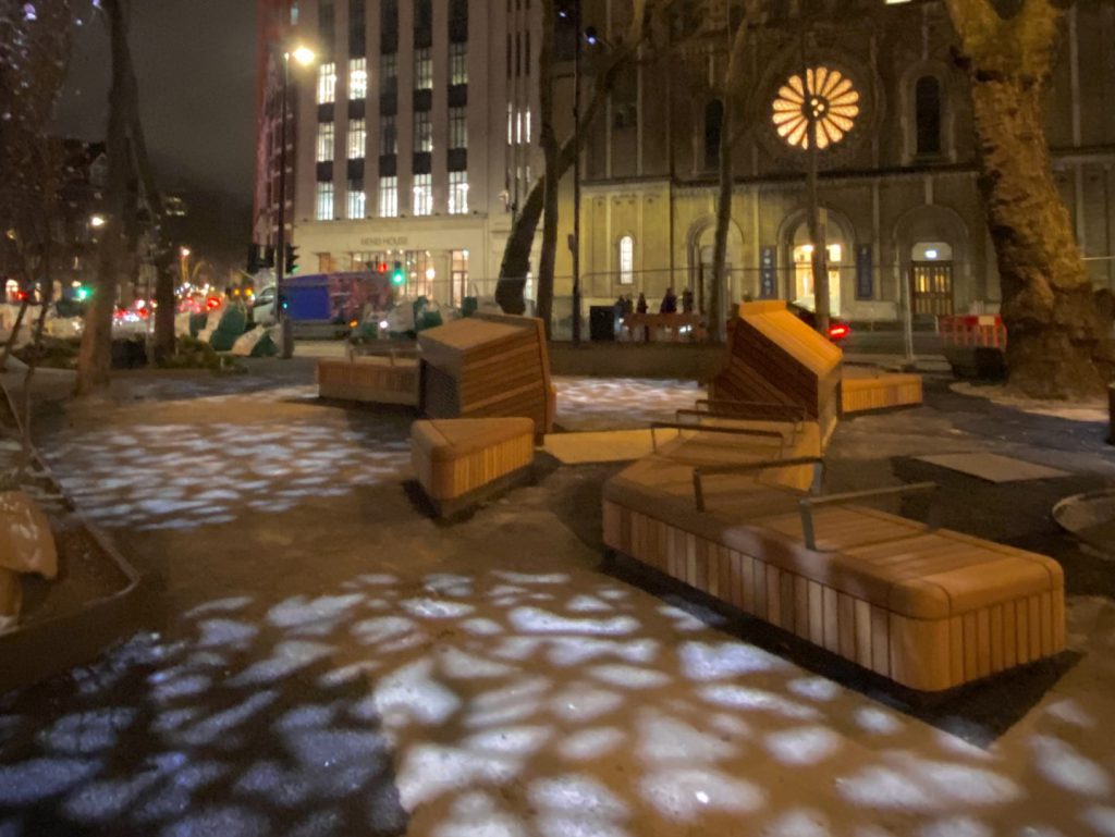 Night image of Princes Circus with shapes projected on the ground